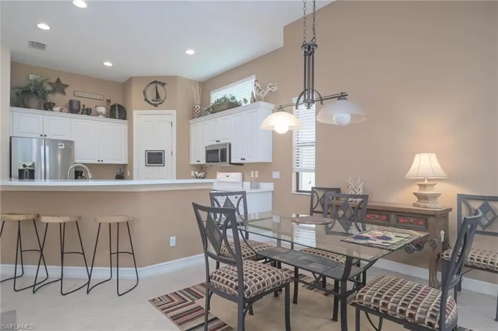 Dining room featuring a wealth of natural light and light tile patterned floors