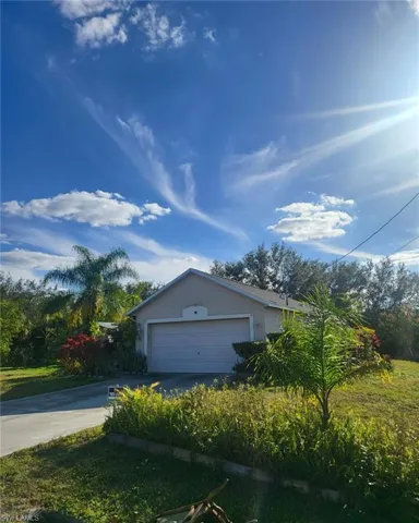 View of side of home with a garage