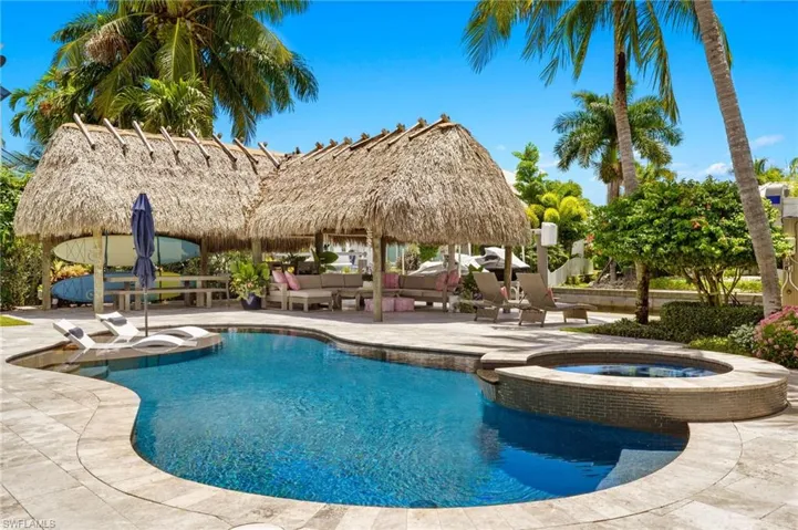 View of swimming pool featuring outdoor lounge area, an in ground hot tub, a patio area, and a gazebo