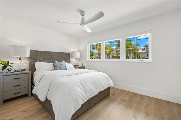 Bedroom featuring ceiling fan and light wood-type flooring