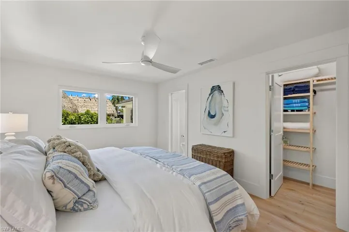 Bedroom featuring ceiling fan and light hardwood / wood-style floors