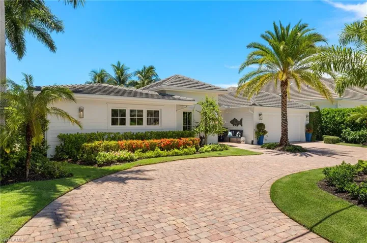 Mediterranean / spanish home with a garage