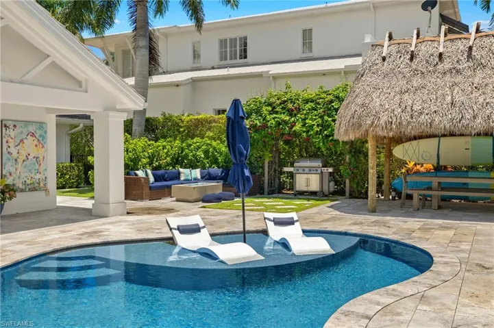 View of swimming pool with a patio area, a gazebo, an outdoor hangout area, and grilling area