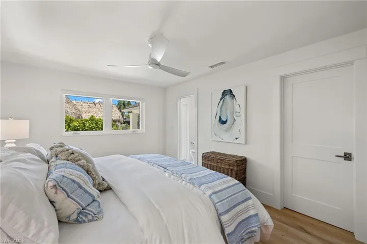 Bedroom with light wood-type flooring and ceiling fan
