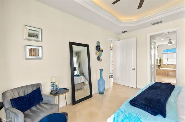 bedroom has pocket door to bathroom area
