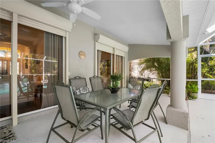 View of patio / terrace featuring outdoor dining space and a ceiling fan