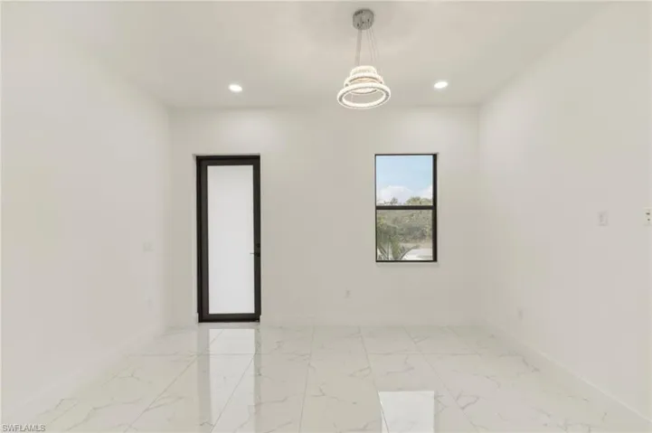 Empty room with a chandelier