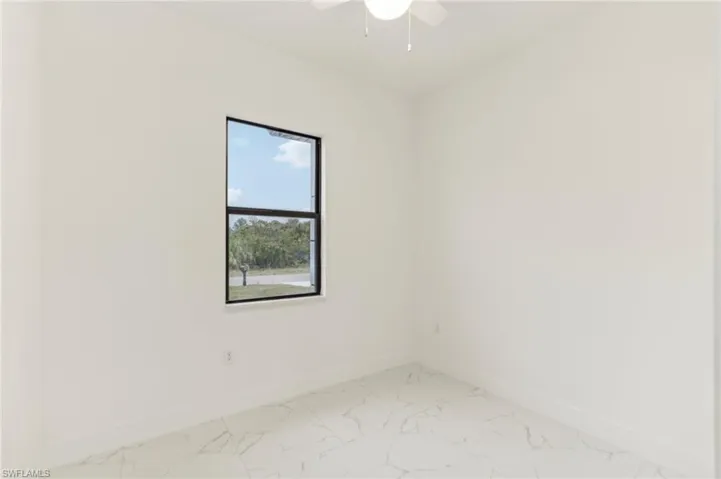 Spare room featuring ceiling fan