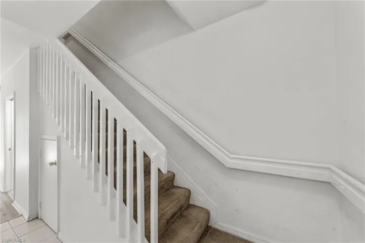 Stairs with tile patterned flooring