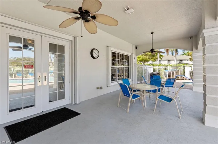 View of patio featuring french doors, ceiling fan, and outdoor dining space