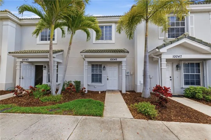 Mediterranean / spanish home with stucco siding and a tiled roof