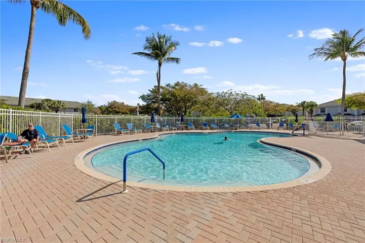 Community pool with a patio area