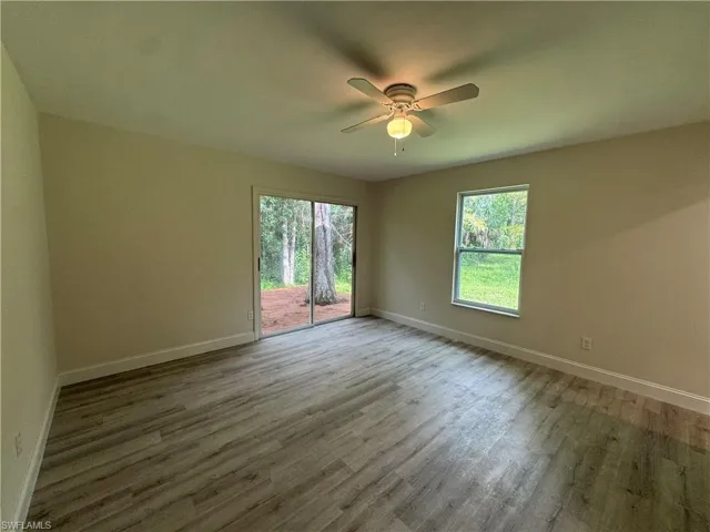 Spare room featuring light wood-style floors and ceiling fan
