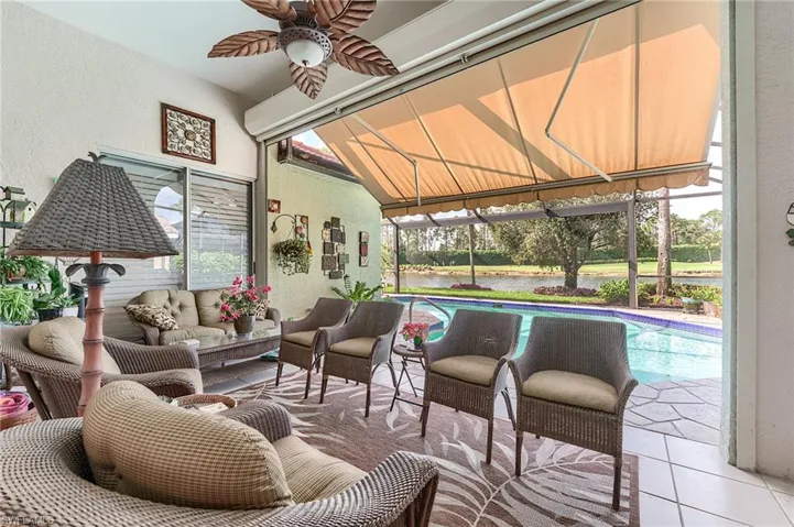 Sunroom / solarium with ceiling fan and an outdoor living space