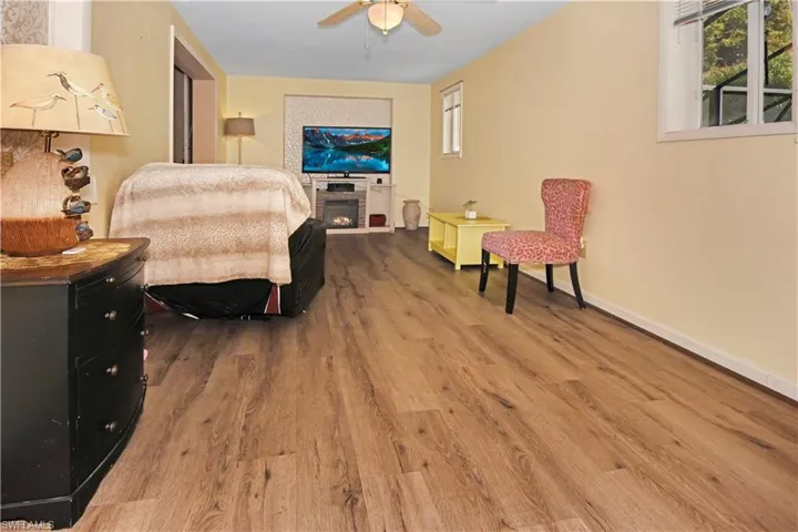 Bedroom with wood finished floors and ceiling fan