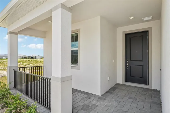 Property entrance with stucco siding