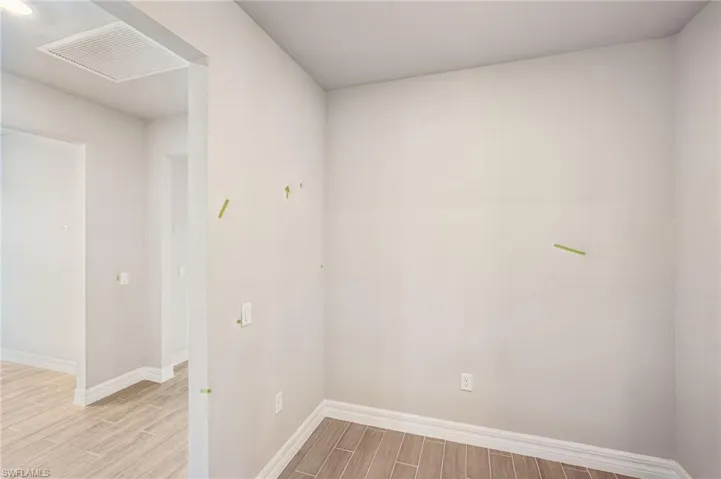 Spare room with light wood finished floors and baseboards