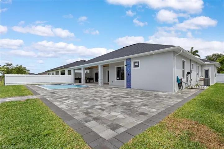 Rear view of property featuring a patio area and stucco siding