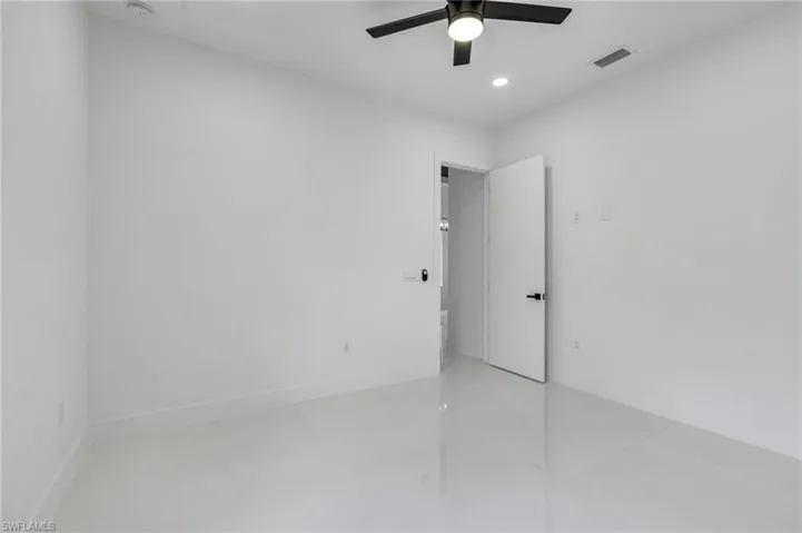 Spare room featuring recessed lighting, light tile patterned flooring, and a ceiling fan