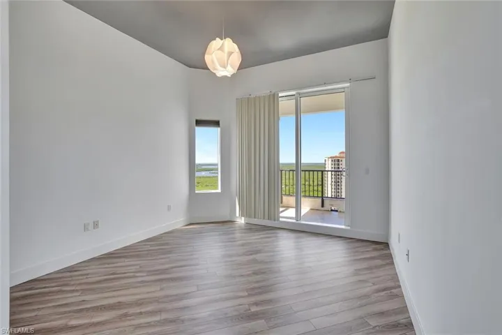 Empty room featuring light wood-type flooring and baseboards