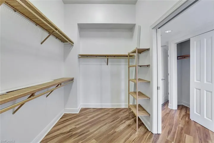 Walk in closet featuring light wood-style floors