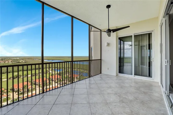 Unfurnished sunroom with a water view