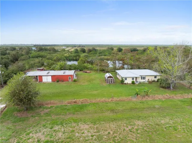 Drone / aerial view with a rural view and a water view