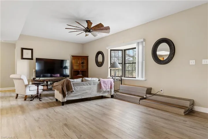 Bedroom featuring ceiling fan and light hardwood / wood-style flooring