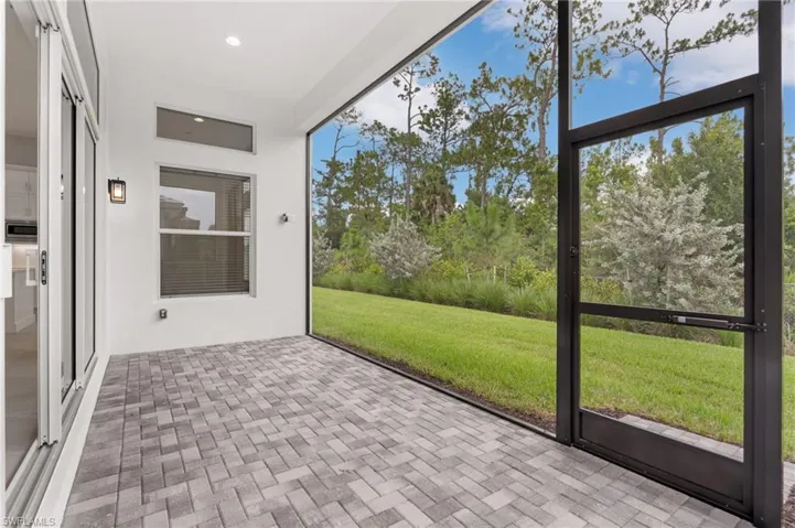 Screened outdoor living space featuring  wall-mounted lighting fixtures, recessed ceiling lighting.