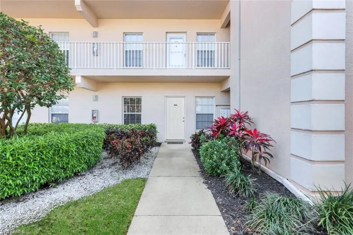 Property entrance featuring stucco siding