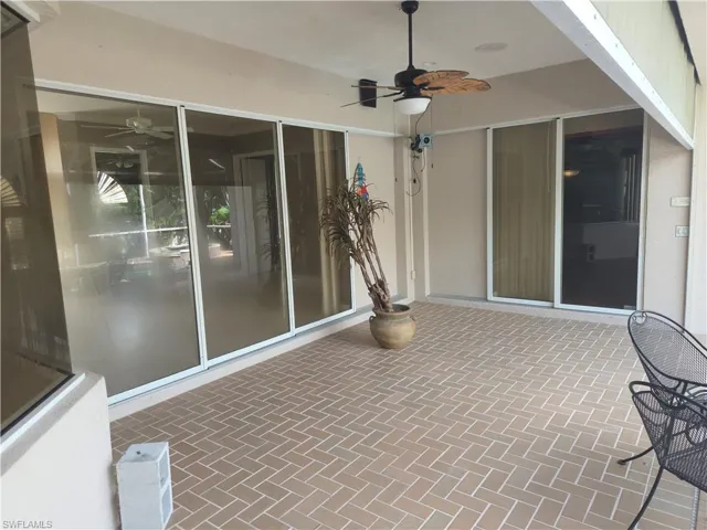 View of patio featuring ceiling fan