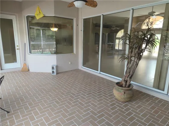 View of patio featuring a ceiling fan