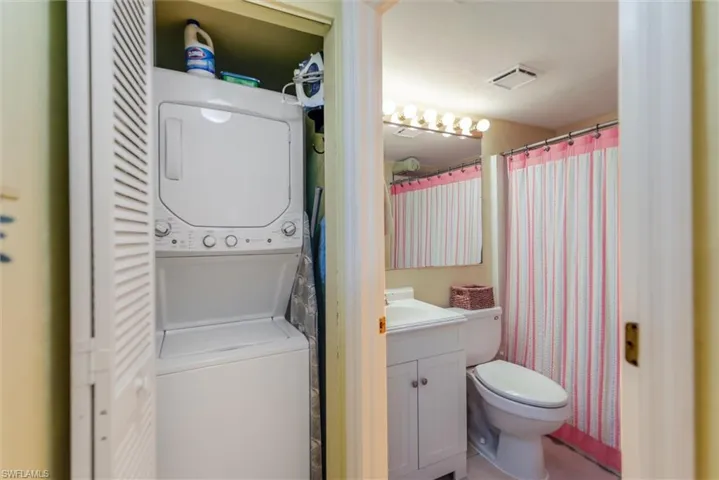 Bedroom featuring ceiling fan, ornamental molding, a closet, and light tile patterned floors
