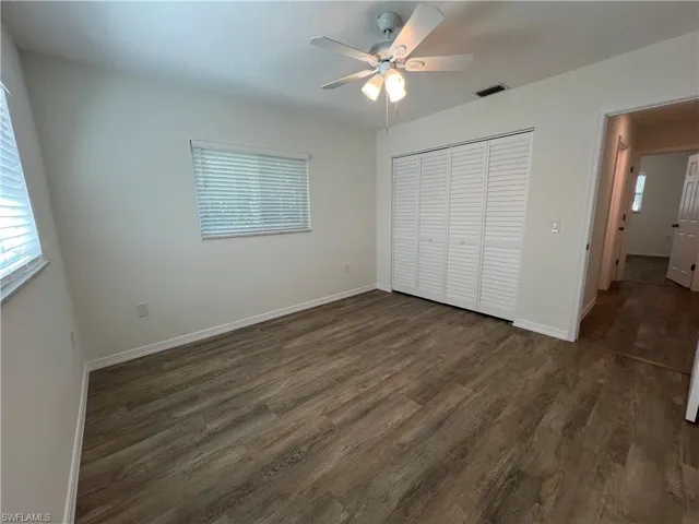 Guest bedroom #1 with ceiling fan and large closet