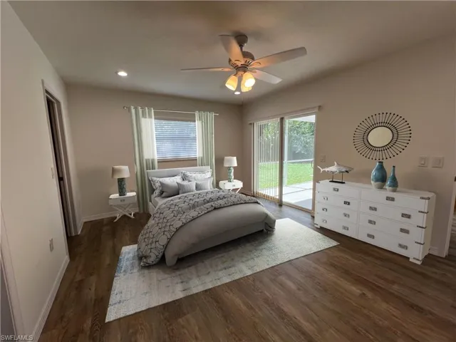 Virtually staged primary bedroom with en suite bath and walk-in closet