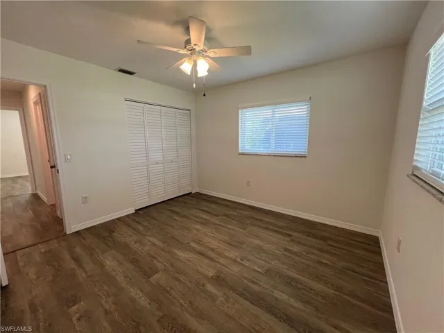 Guest bedroom #2 with ceiling fan and large closet