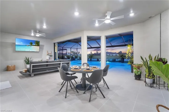 Tiled dining space with ceiling fan