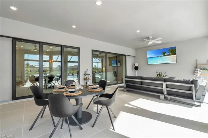 Dining room featuring ceiling fan and light tile patterned flooring