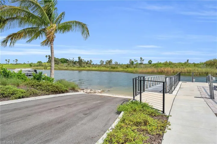 Dock area featuring a water view