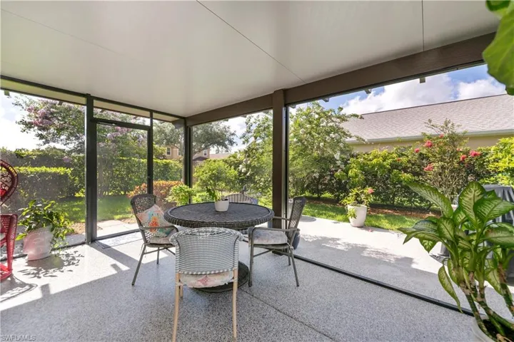 Sunroom featuring outdoor dining space and plenty of natural light