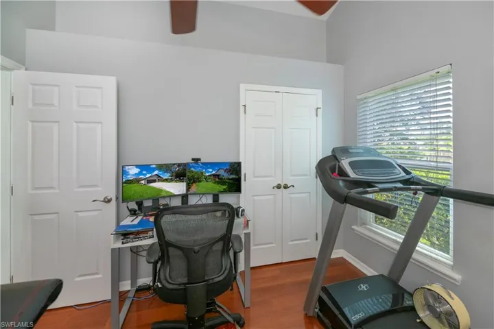 Office with ceiling fan and wood finished floors