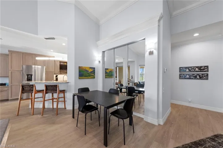 Contemporary kitchen featuring wood-finish cabinetry, granite countertops, a built-in stainless steel microwave, and a stainless steel range
