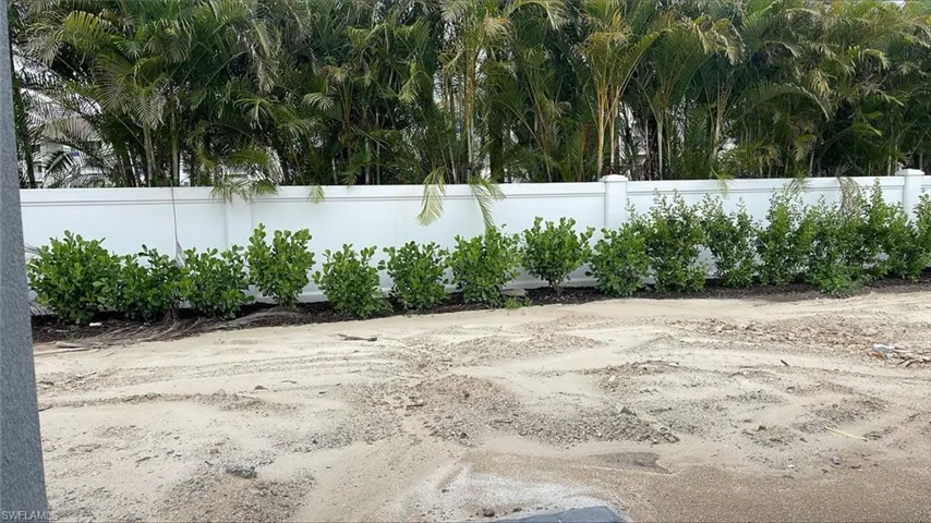 Backyard with private fencing and landscaping