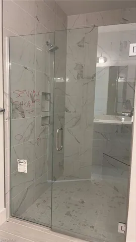 Primary bathroom frameless, walk-in shower