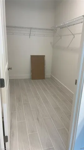 Primary bedroom walk-in closet