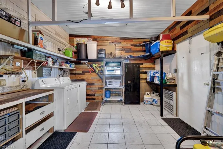 Washer, dryer, and room to store your holiday decorations in the spacious shed.