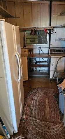 Kitchen featuring white refrigerator and washer / clothes dryer