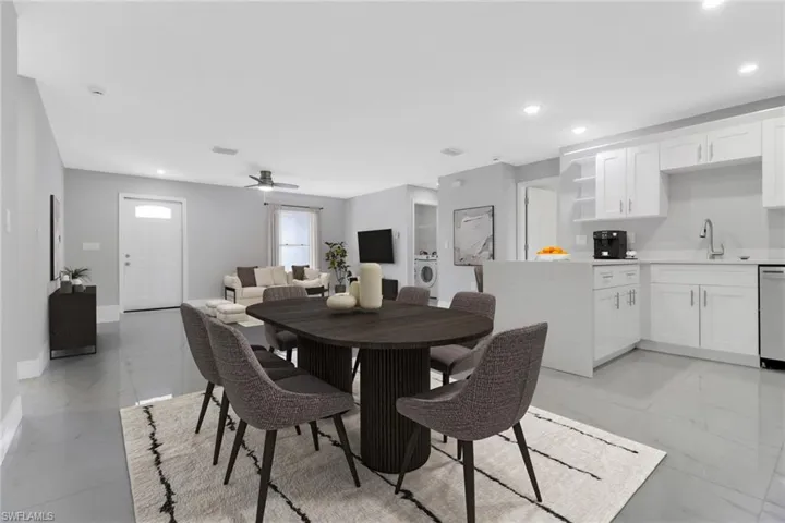 Dining space with light marble finish floors, recessed lighting, baseboards, independent washer and dryer, and ceiling fan