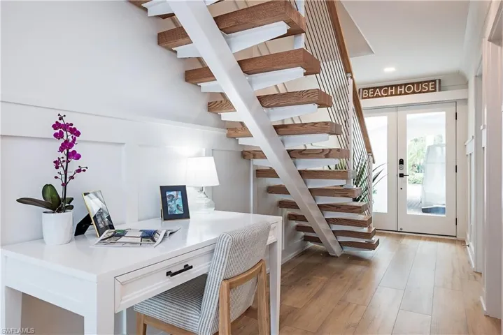 Office featuring french doors and light hardwood / wood-style flooring