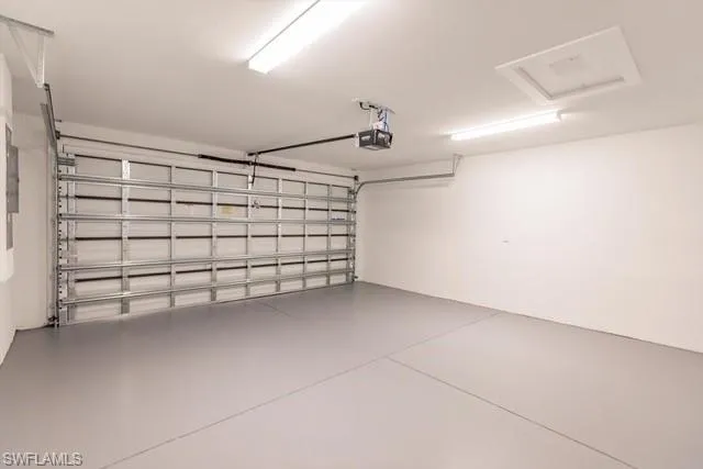 Garage featuring a garage door opener